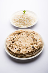 Chapati / Roti with Cooked plain rice, selective focus