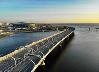 8 may 2019, St. PETERSBURG Russia: Aerial view of Football stadium Zenit Arena at sunset and new road - Western High Speed Diameter connecting Krestovsky and Vasilyevsky Islands. Viaduct above Neva.