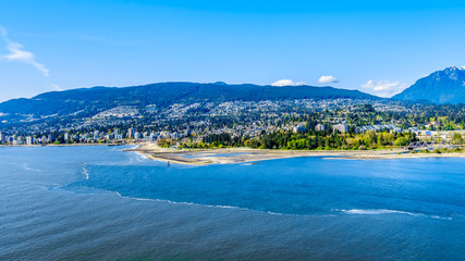 North Vancouver and West Vancouver across Burrard Inlet, the entrance into Vancouver harbor viewed from Prospect Point in Vancouver's Stanley Park 