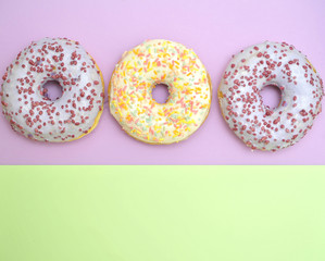 Tasty donuts on pink background. National donuts day.