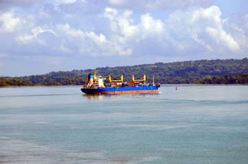 Cargo container ship transiting through Panama Canal.