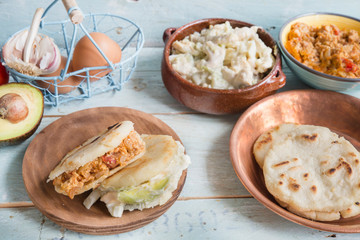 Arepas with reina pepiada and egg revueltos