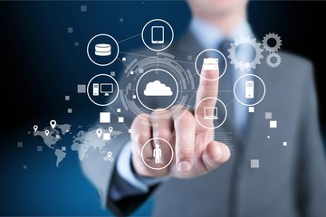 Businessman and internet and virtual reality concept - businessman pressing button on virtual screens