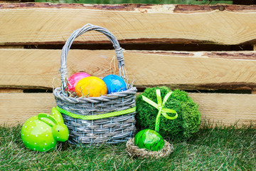 Traditional Easter basket with colorful eggs.