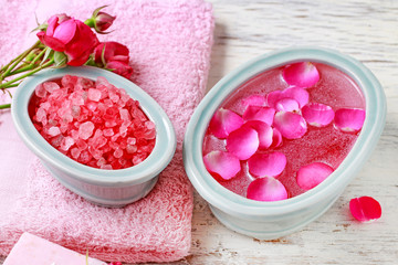 Obraz na płótnie Canvas Nail spa enriching treatment with essential oils and rose petals.