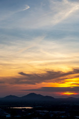 Sunset with small town and mountain