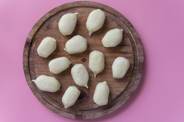 Preparing gnocchi stuffed with pesto