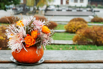 Bouquet of flowers in pumpkin.