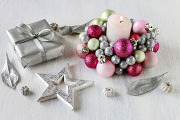 Candle holder made of glass balls and silver gift. Beautiful table decoration