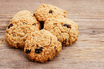Oatmeal cookies on wooden table.