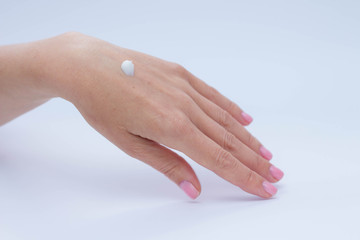 beautiful soft hands of a woman and handcream skincare