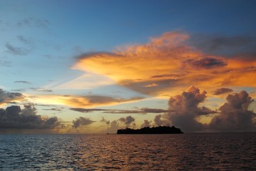 Gorgeous clouds over the silhouette of Managaha Island, Saipan at sunset