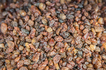 dried fruits. lots of organic raisins in the background. dried raisins background