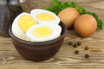Sliced boiled eggs, with parsley leaves. Cooking a salad with boiled eggs.