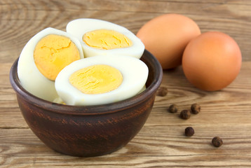 Sliced boiled eggs. Cooking a salad with boiled eggs