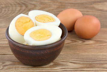 Sliced boiled eggs. Cooking a salad with boiled eggs