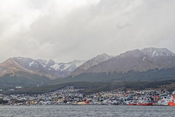 Argentina, Patagonia - a human settlement on the background of mountains at dusk.