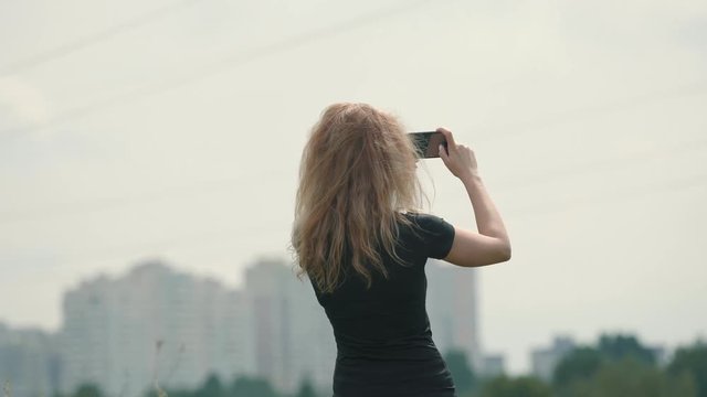 Sport Woman Taking Photo After Running.Athlete Girl Taking Photo After Exercise.Running Girl Use Smartphone For Photo. Sport Woman Use Smartphone. Runner Use Mobile Phone. Woman Take Picture In Field.
