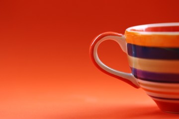 Colorful cup closeup orange texture background