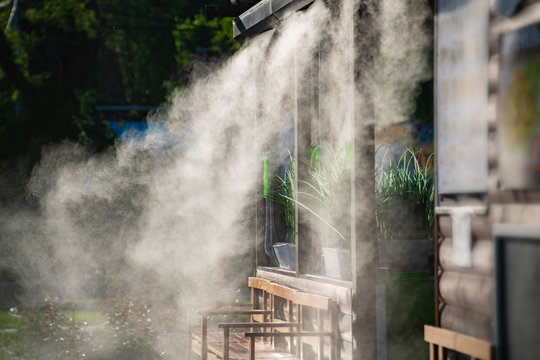 Water Spray System For Cooling In A Public Cafe At The Boiling Hot Summer Days