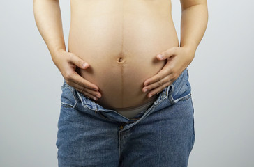 Naklejka premium Pregnant woman hands
