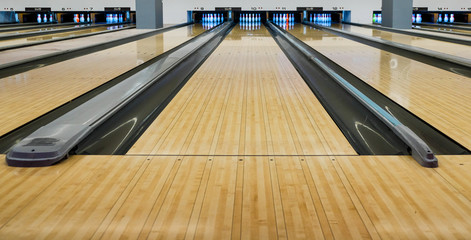 Bowling wooden floor with lane, Generic Bowling Alley lanes with bowling ball going towards the pins.
