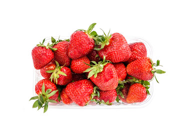 a lot of strawberries in a sudochka closeup on white background
