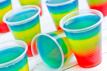 Colorful striped jelly on white background, rainbow jelly for kids party