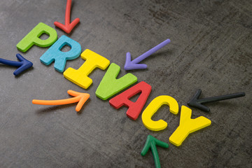 Privacy, GDPR or General Data Protection Regulation concept, colorful arrows pointing to the word PRIVACY at the center of black chalkboard wall, important of internet information data regulation
