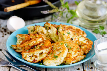 Pan fried zucchini pancakes stuffed with meat