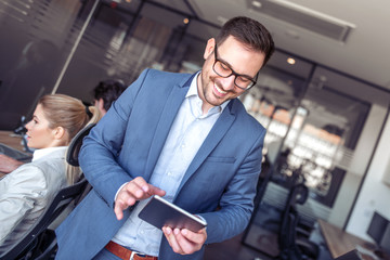 Businessman using tablet in office