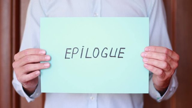 Holding "Epilogue" inscription in hands