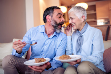 Romantic mature couple having birthday party