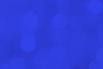 A brilliant blurry background of blue. Template for a holiday greeting card and labels with a pattern of circles with neon glitter.
