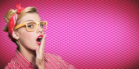 Attractive young surprised woman posing on white background