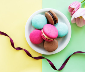 Colorful macaroons and tulips