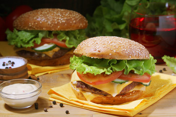 Two fresh hamburgers with vegetables	
