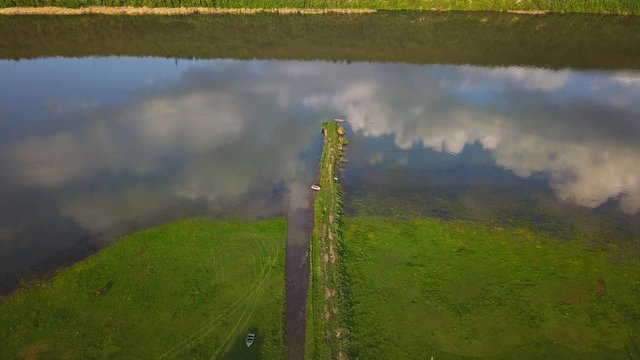 Flying over the river on a sunny summer day. Dniester river of Moldova republic.