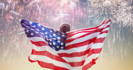 Person holding the Flag of the USA.