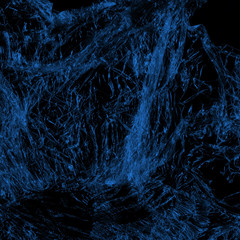 Transparent blue plastic wrap on the black background. Plastic shopping bag texture. Reusable trash and waste.