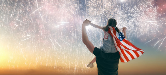 People holding the Flag of the USA.