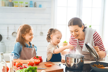Happy family in the kitchen.