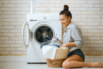 woman is doing laundry