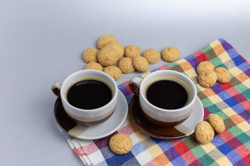 Cookie and two cups of coffee. Kruidnoten, pepernoten, strooigoed