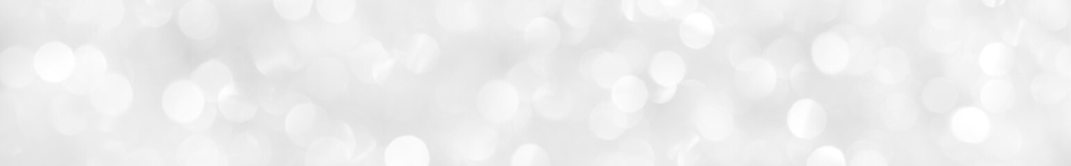 A brilliant white background with circles and ovals. Template for a holiday card with bright and sparkling lights.