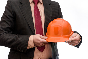 Man in suit holding orange helmet isolated on white