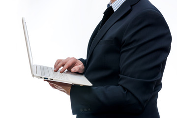 Man in suit holding laptop on white background