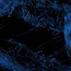  Transparent blue plastic wrap on the black background. Plastic shopping bag texture. Reusable trash and waste.