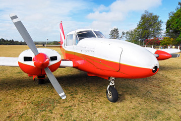 Cuyo Island, Palawan Province, Philippines: Close-up of a red and white colored Piper Aztech cargo business plane parking at the Cuyo airport