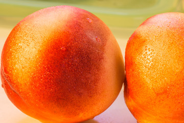 two fresh red peach closeup view
